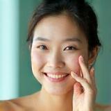 Min Su Choi using skincare